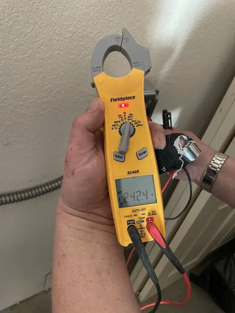 Voltage testing with clamp meter during Hot Tub / Pool Electrical Wiring in Derby
